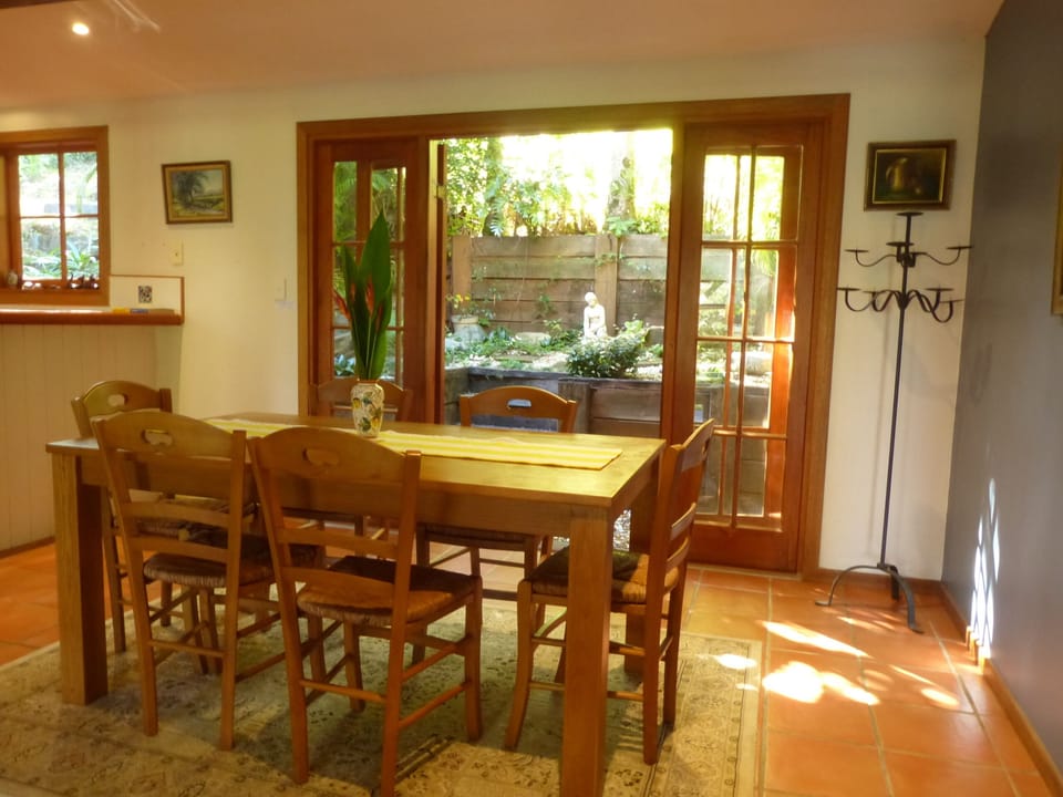Dining area with French doors opening to the rockery