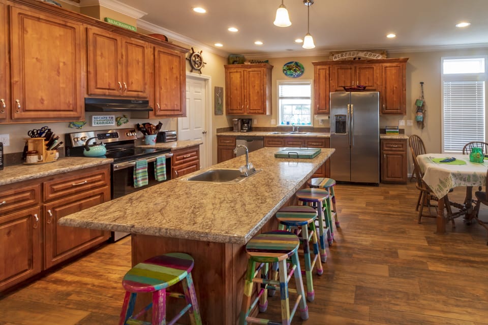 Kitchen island, with prep sink, bar seating for 5 (and 2 extras plus high chair)