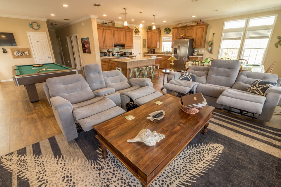 Den, 2 reclining sofas, 65 inch TV, Stereo with remote speakers, DVD, canal view