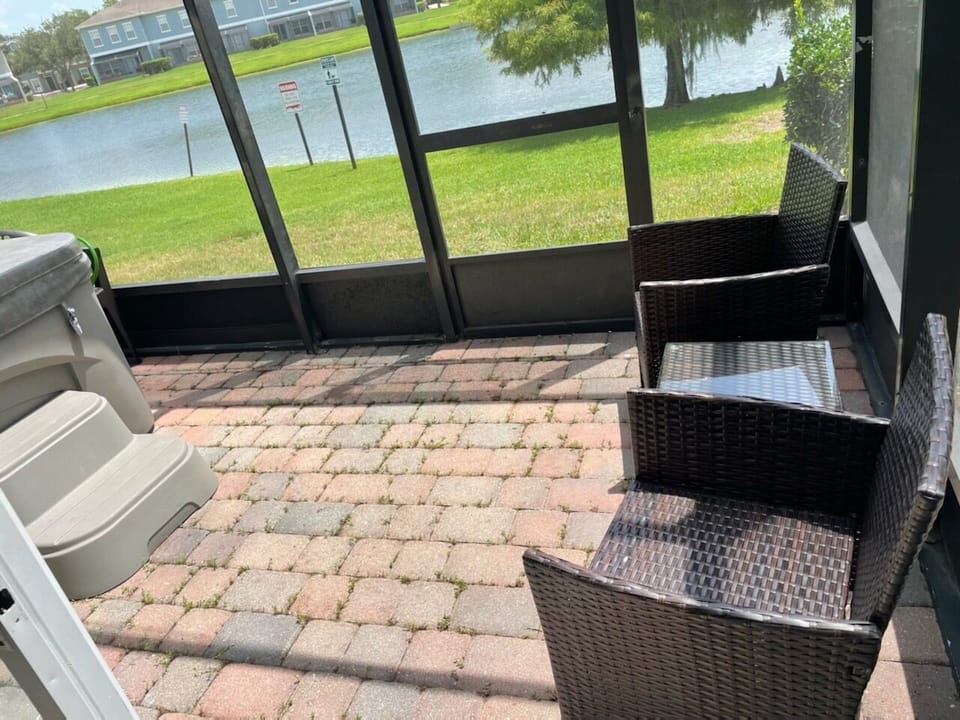 Screened patio with hot tub and lake view