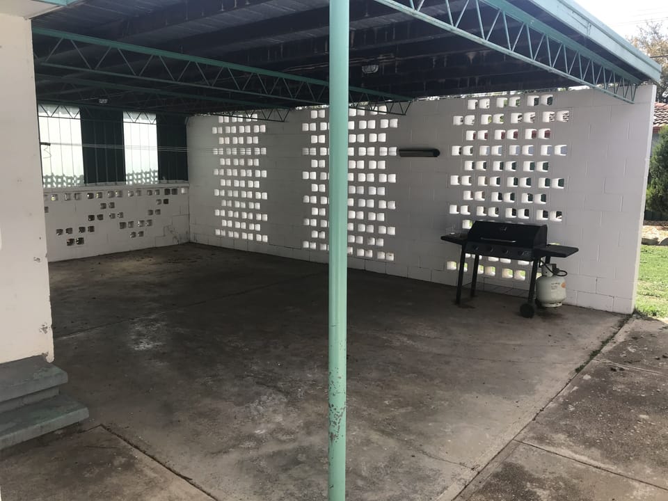 Covered area for clothes drying or BBQing.