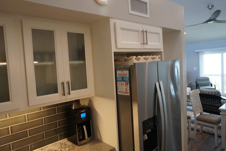 New galley style kitchen is on the top. level with the living/dining room.