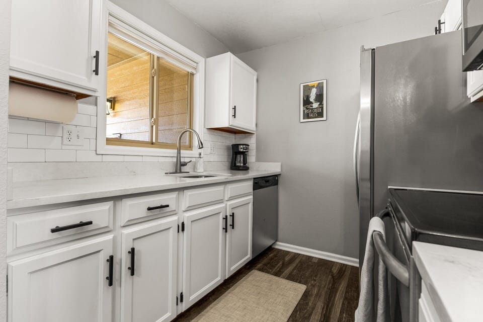 Corian Counters, Window above Sink, Coffee Maker, Built in Stainless Steel Dishwasher