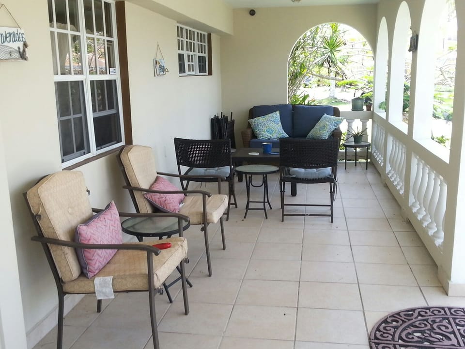 Enjoy sitting and relaxing on our front porch. (Left side shown only)