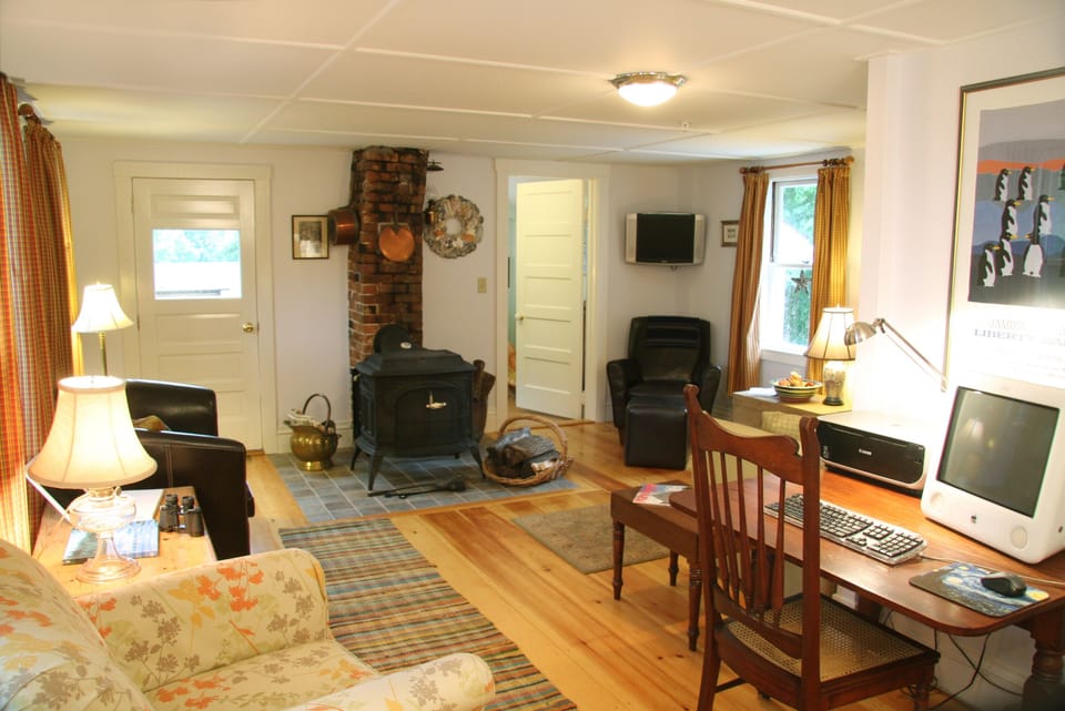 Cosy sitting room with wood stove & computer area.