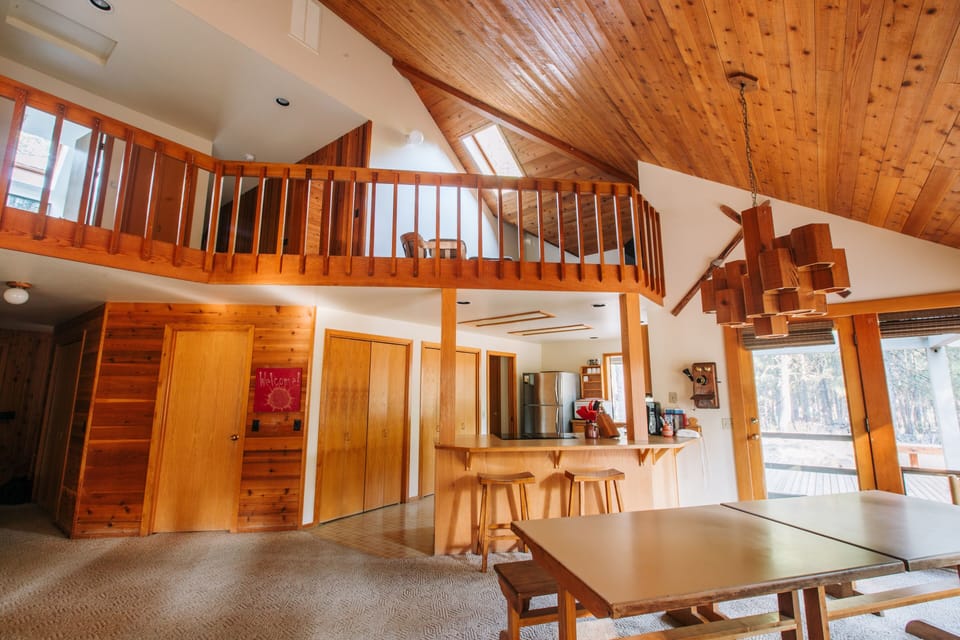 View of the kitchen and loft where TV is located