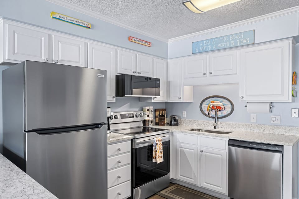 Plenty of kitchen cabinet space, coffee maker and all the fixings for cooking