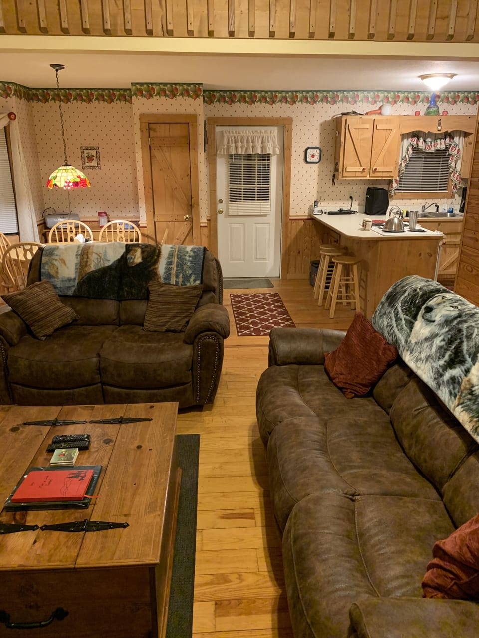Living room facing kitchen and dining