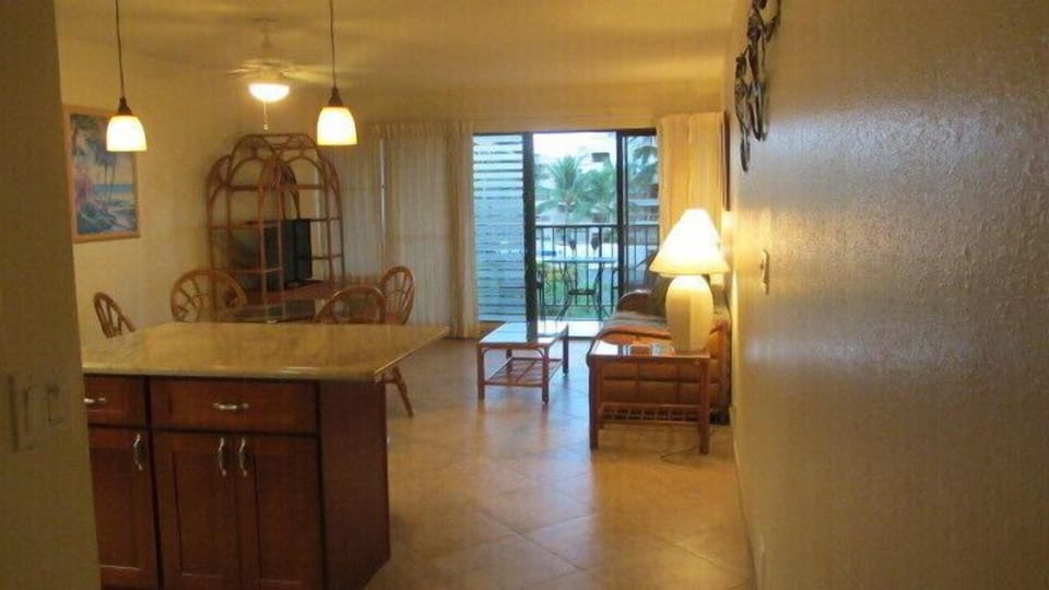 Clean spacious living room with brand new tile floors and updated furniture.