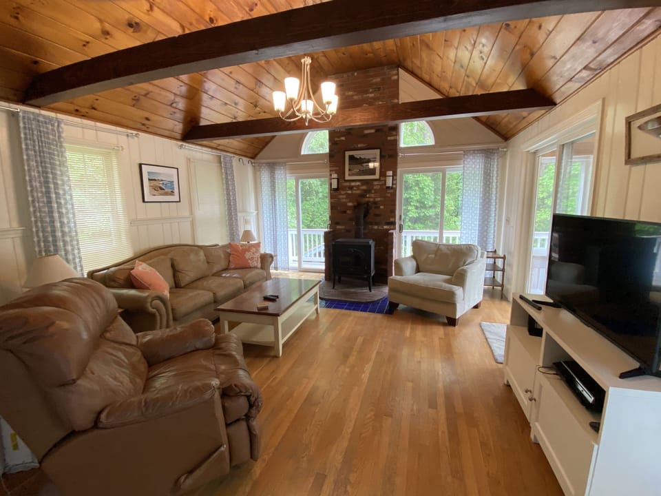 Family room with HDTV TV access to side deck.