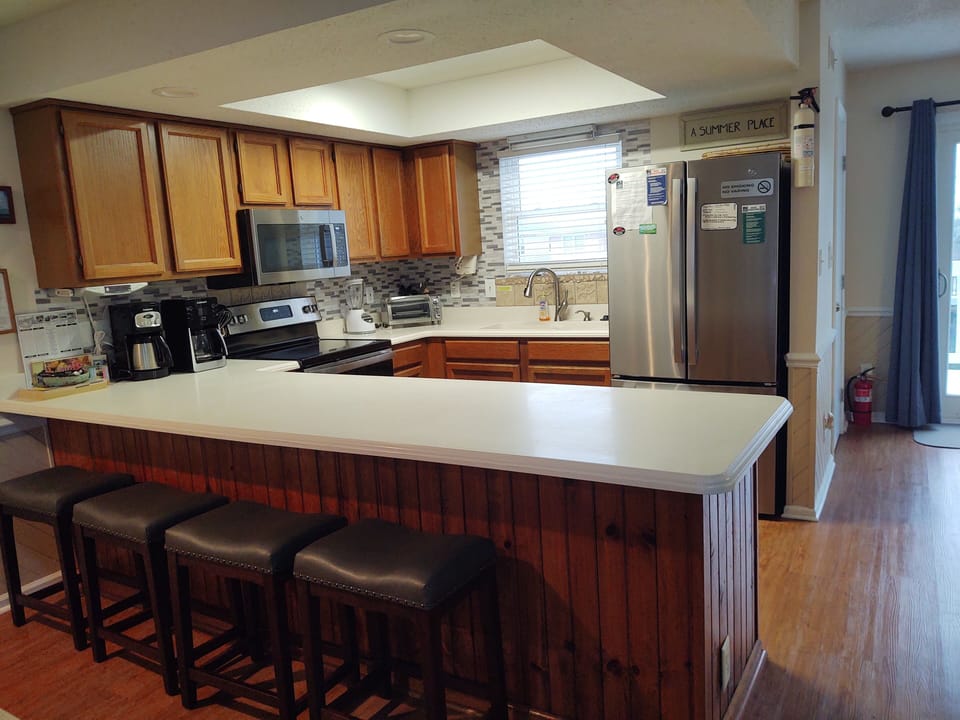 New Stainless Appliances and bar stools 2023'. 