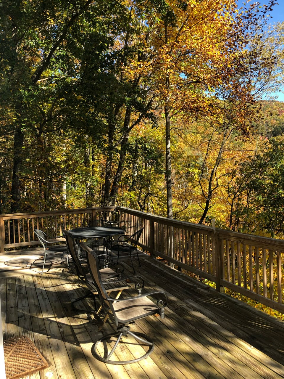Deck looking onto the mountain with patio furniture 
