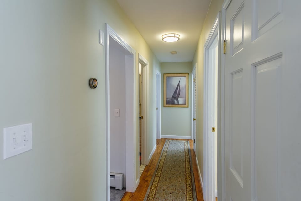 Hallway off kitchen leads to 3 bedrooms.