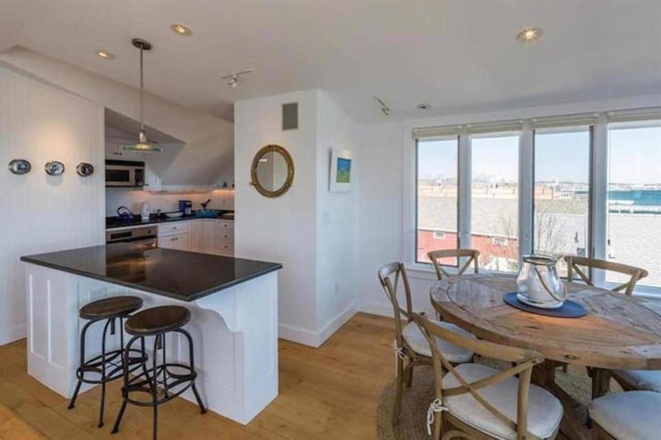 The island creates the perfect transition between the kitchen and living area