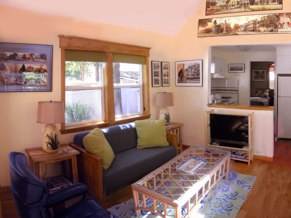 The living room  as you enter the front door with the kitchen just beyond