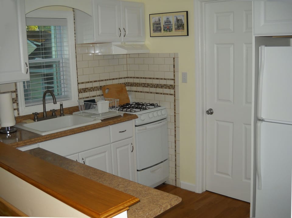 Full kitchen, newly renovated with counter seating for two.