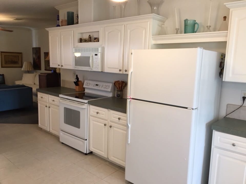 Kitchen with microwave; electric range/stove