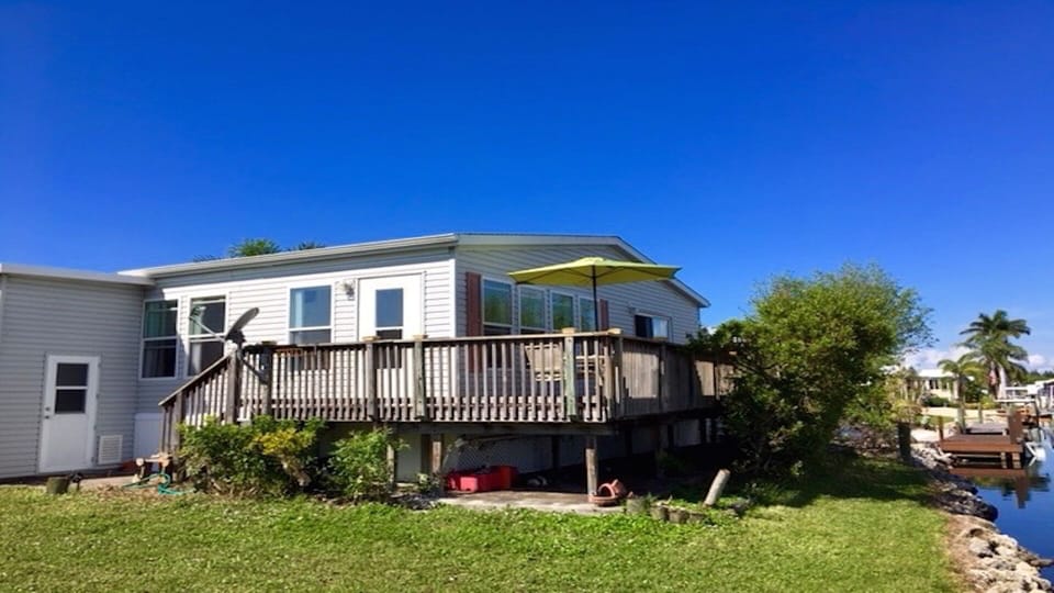 Canal Front Home with Wrap around deck and seating