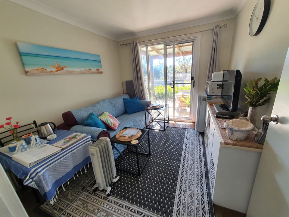 small sitting room viewed from hallway towards front verandah