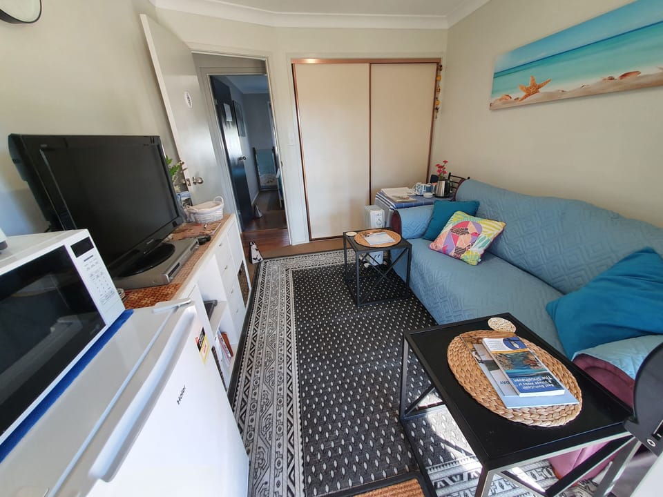 small sitting room - includes tower fan and evaporative cooler in summer
