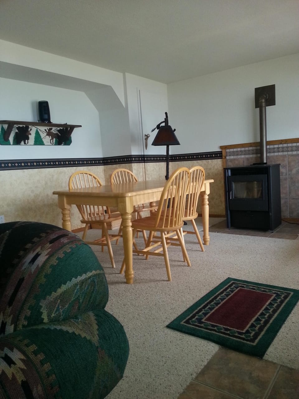Lower level family area with pellet stove and table for four