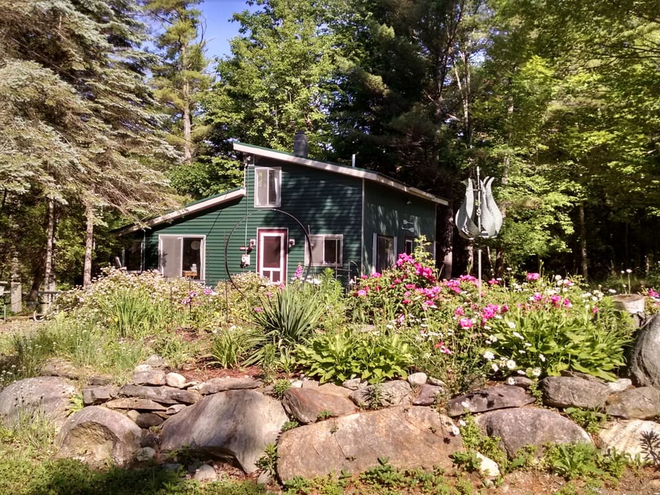 A darling circular driveway, filled with blooming perennials, new every week!