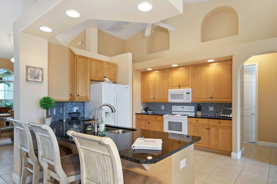 The fully-equipped kitchen has room for 3 at the breakfast bar