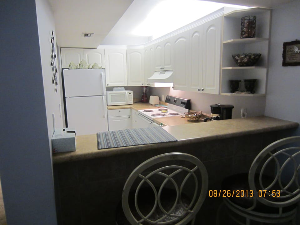 Full kitchen with extra seating at bar