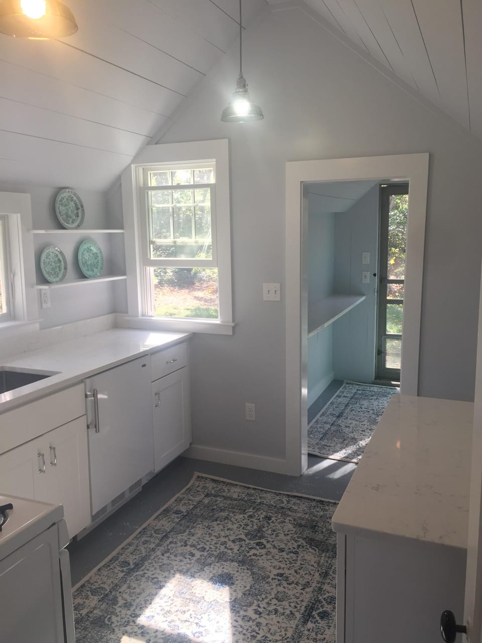 Kitchen and entryway view. 
