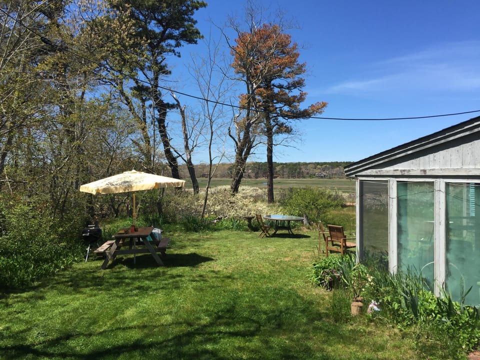 Screened in patio and picnic table.
