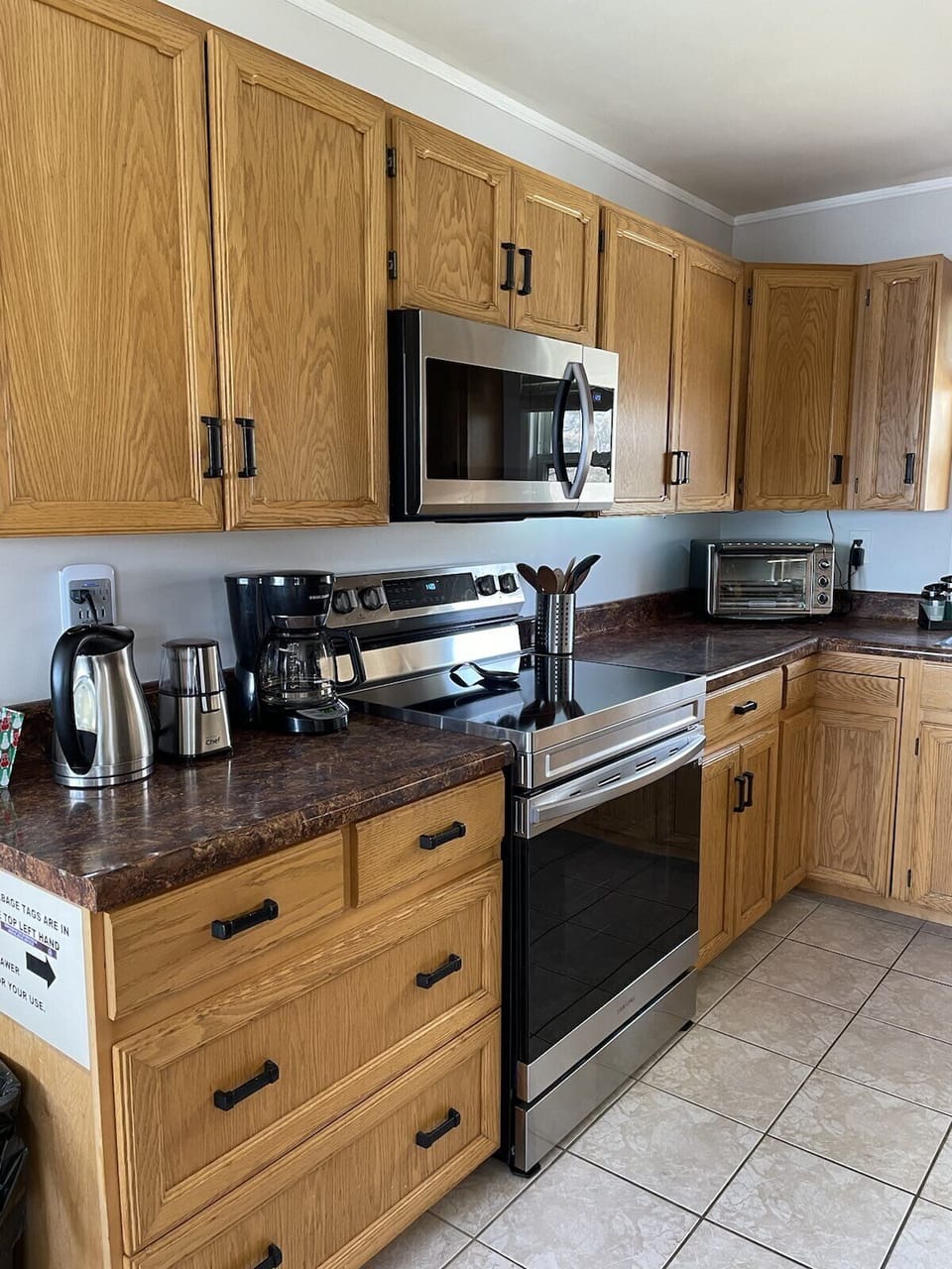 Kitchen  with stove/oven, microwave/vent, toaster oven, coffee maker and grinder