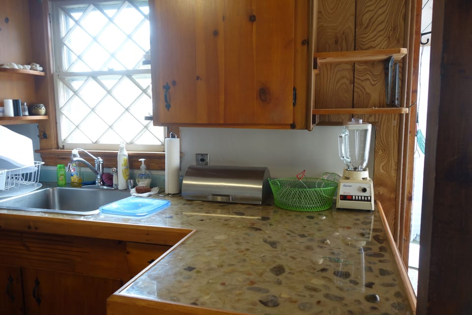 Kitchen: unique custom counter, made with pebbles from our semiprivate beach!