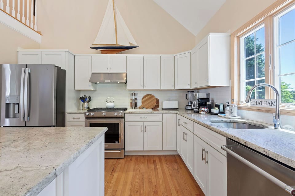 Gorgeous kitchen with granite countertops and stainless steel appliances. 