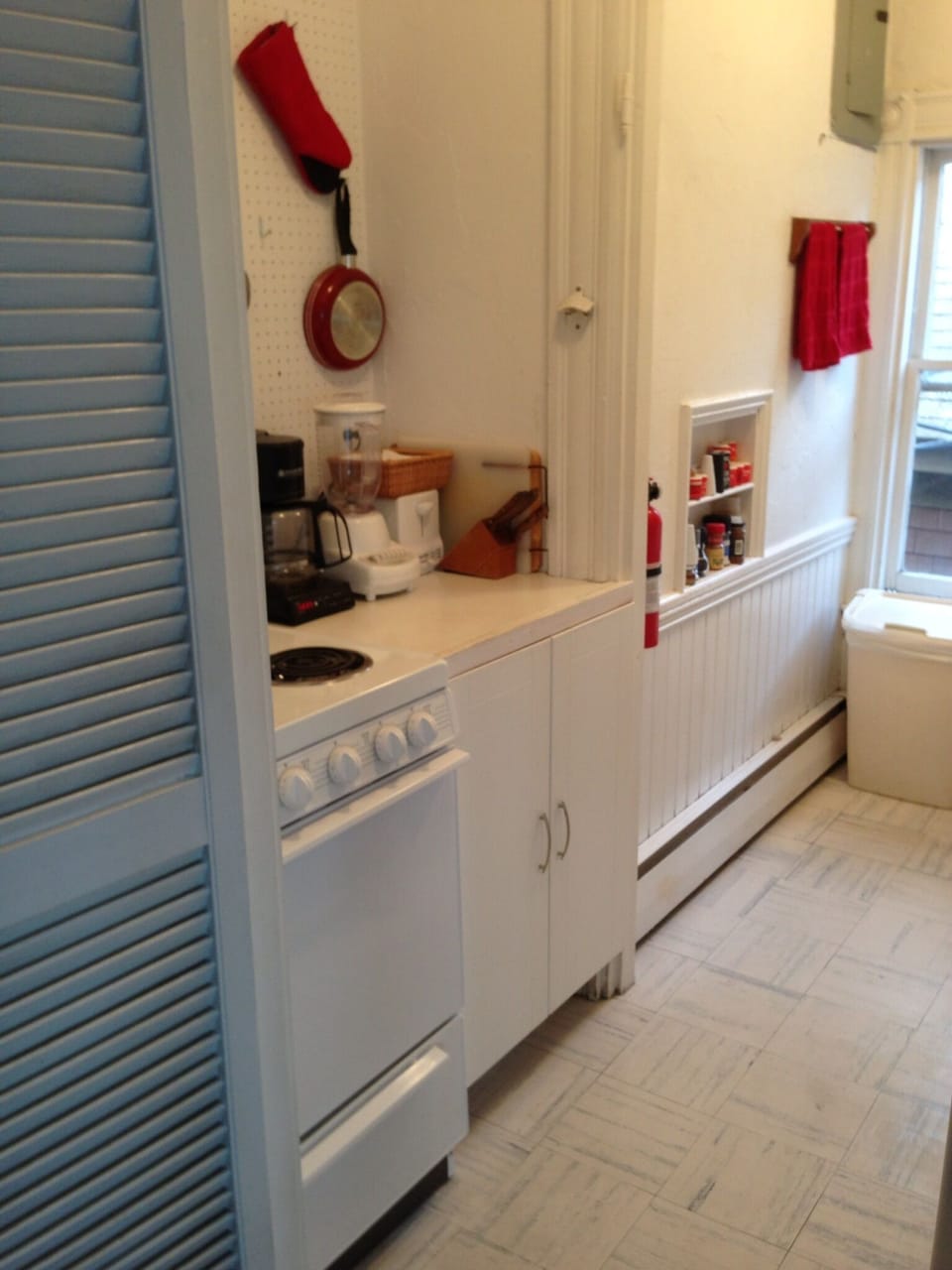 galley kitchen w stove, fridge, keurig coffee maker, toaster, microwave, etc.
