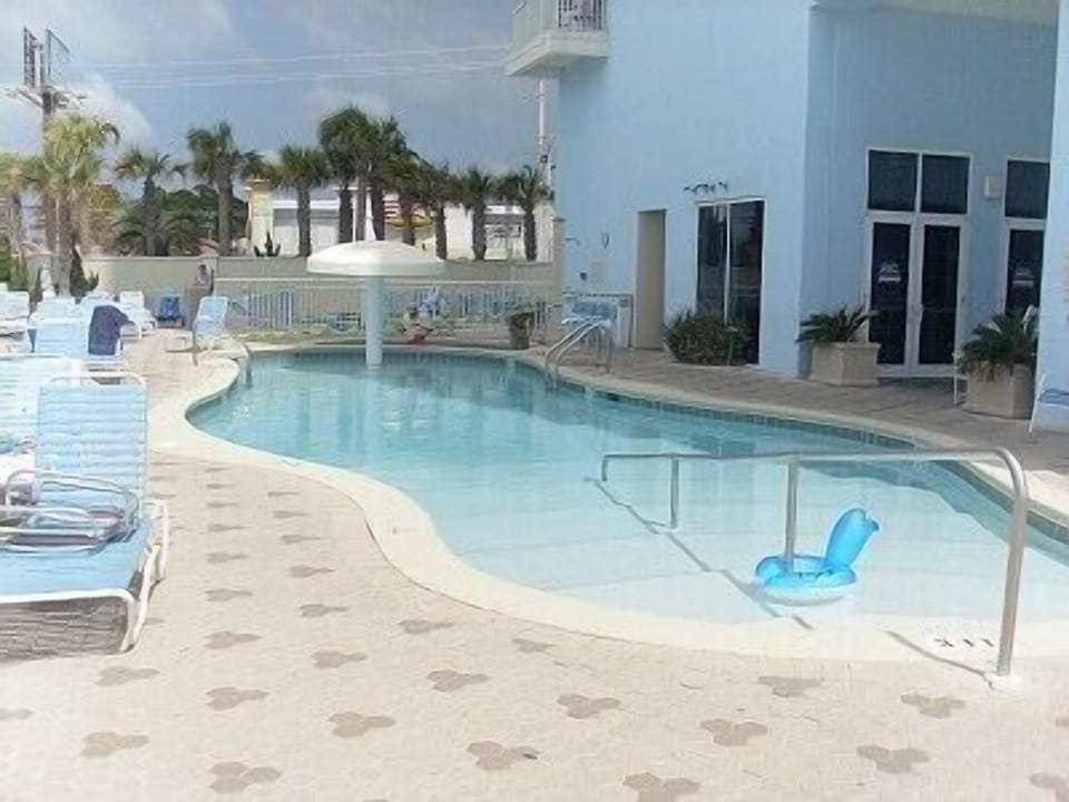 Outdoor pool right on beach with full service restaurant and bar in season. 