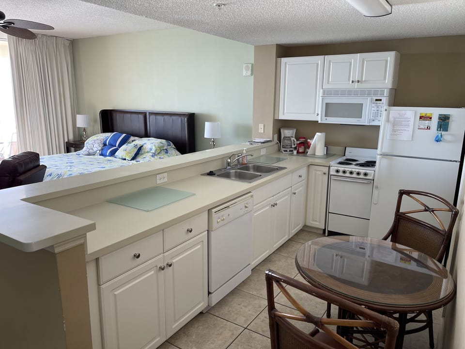 Kitchen area.Ccook, bake, and clean up with a dishwasher. Washer/Dryer in closet