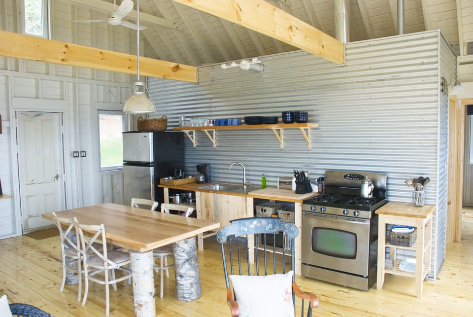 well-equipped kitchen for cooking (with gas stove) and hand-mad birch table.