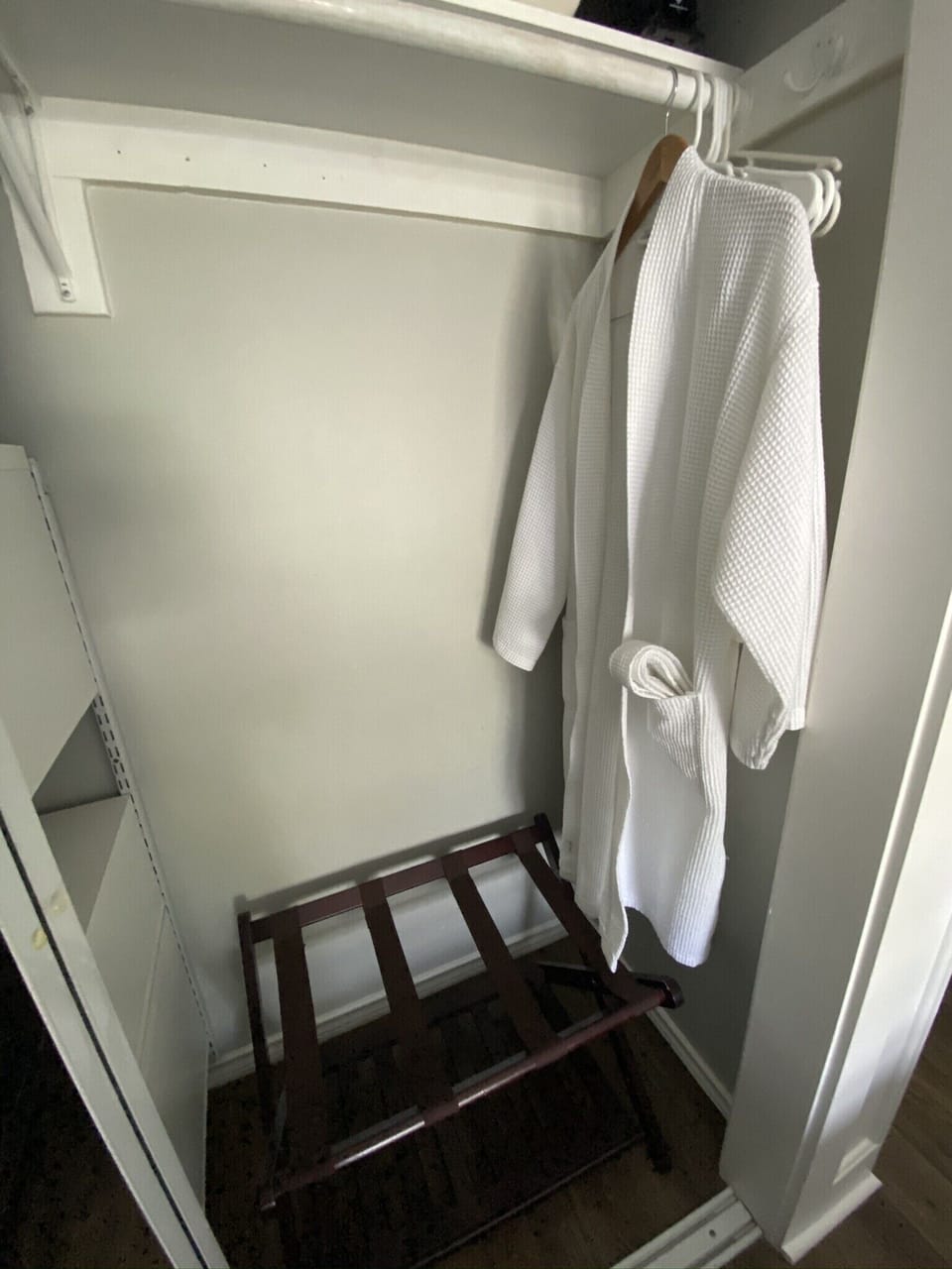 Luggage rack and robe in each closet.