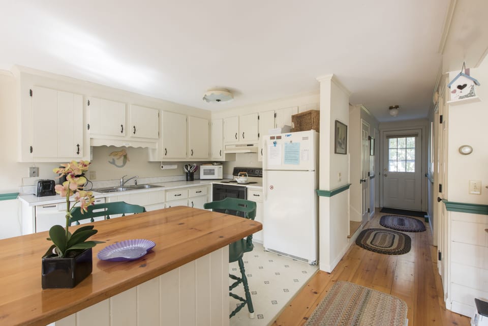 down hall leads to up stairs, cellar laundry,  down bath and to master bed 