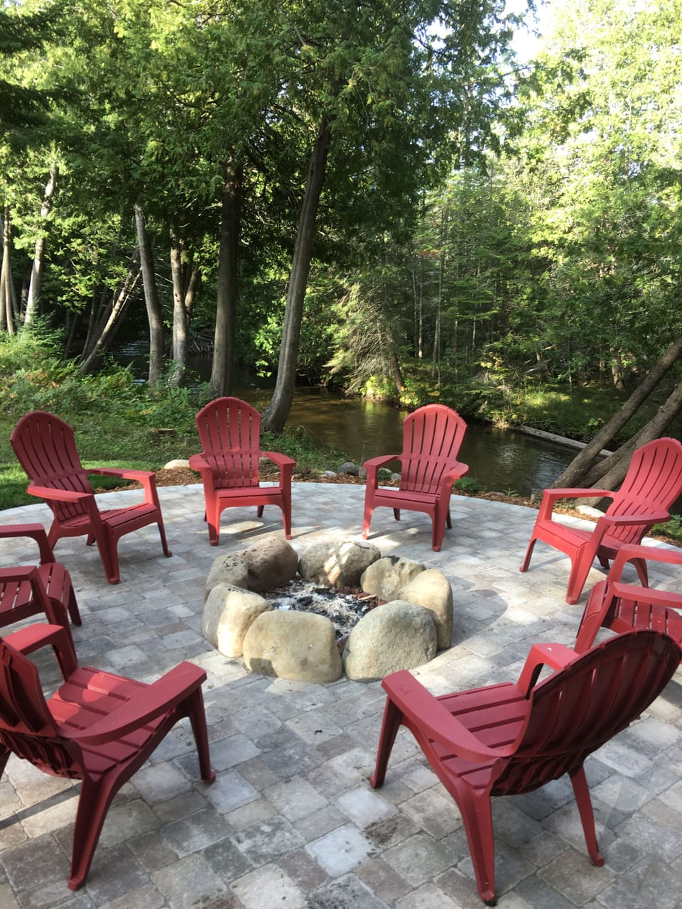 Firewood and seating provided overlooking the Sturgeon River.