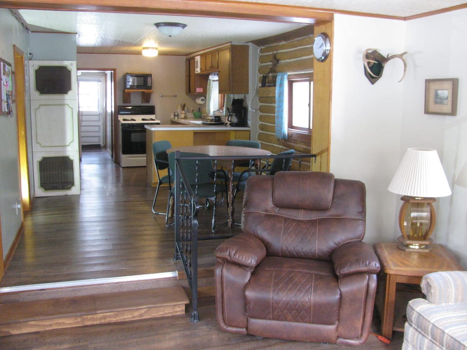 Open concept floor plan making living room, dining room, and kitchen feel larger