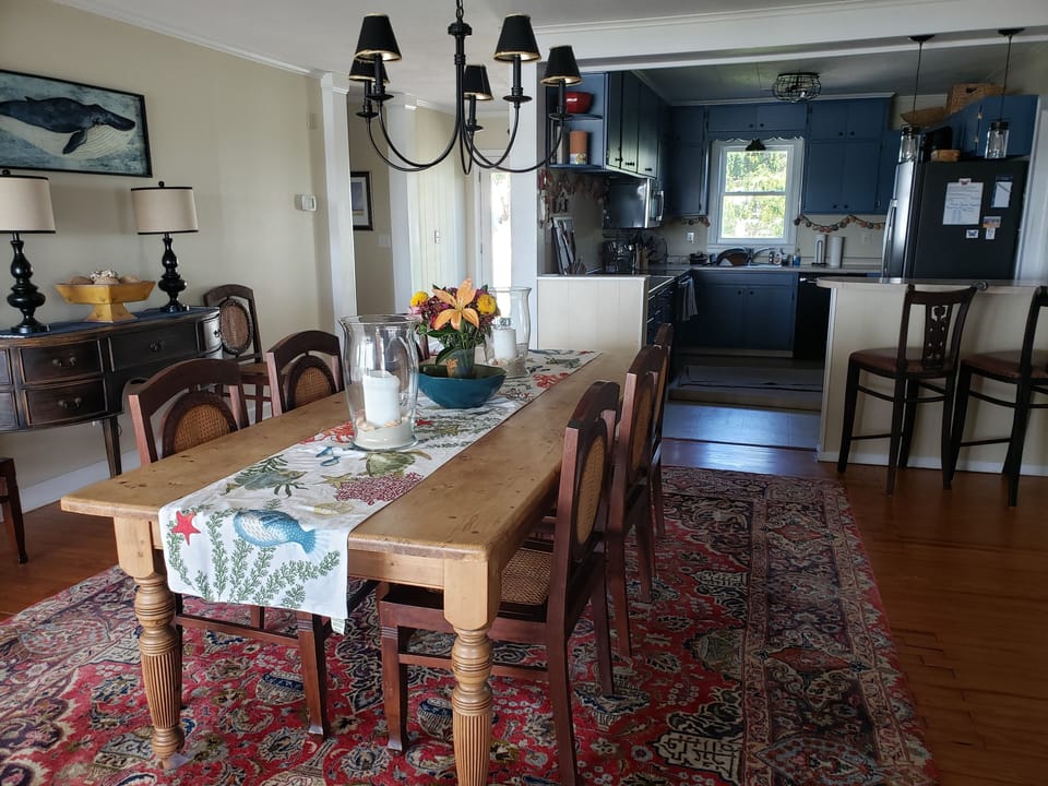 Dining room with breakfast bar and kitchen beyond
