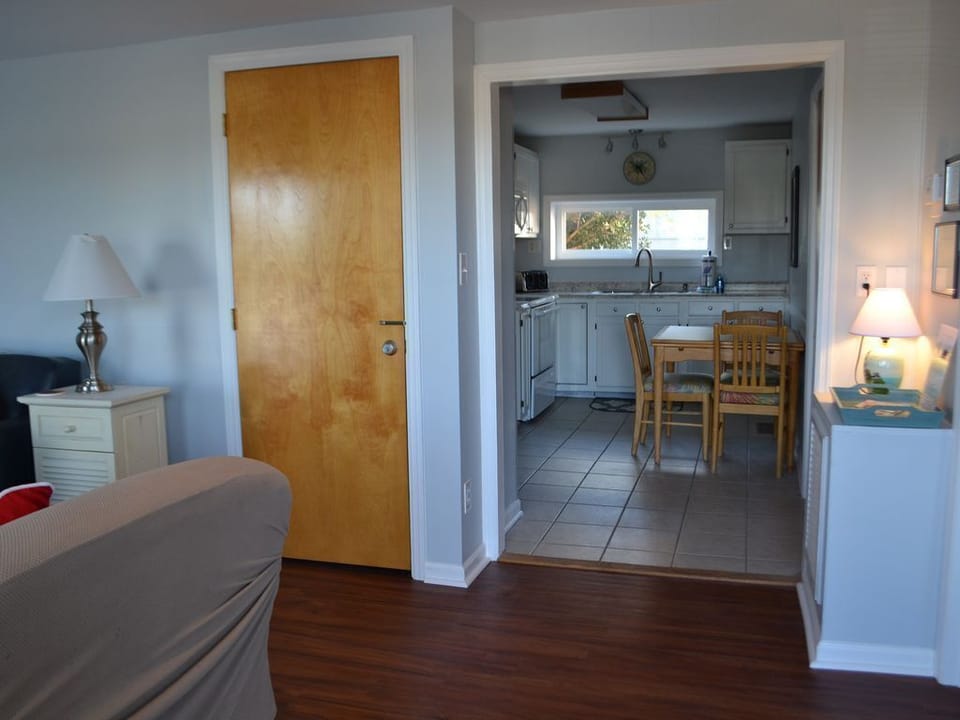 From the front entry - bedroom 1 to the right, living to the left. Kitchen ahead