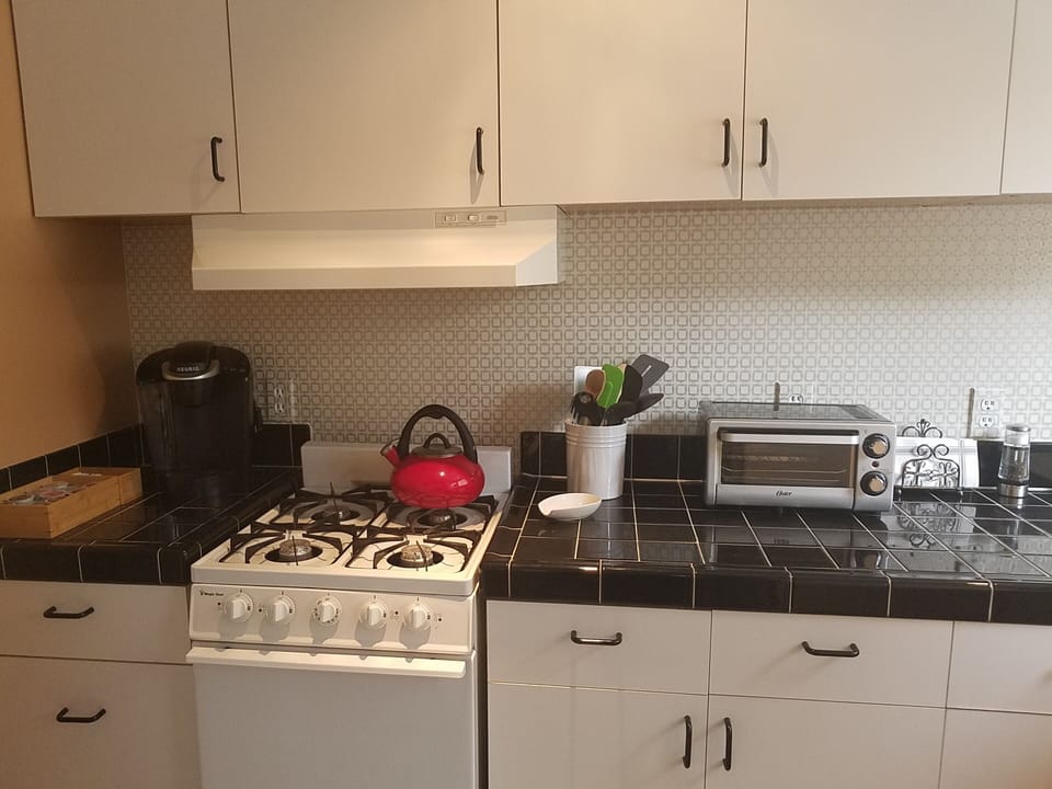 Your Kitchen has a stove, oven, toaster oven, teapot and Keurig coffee maker.