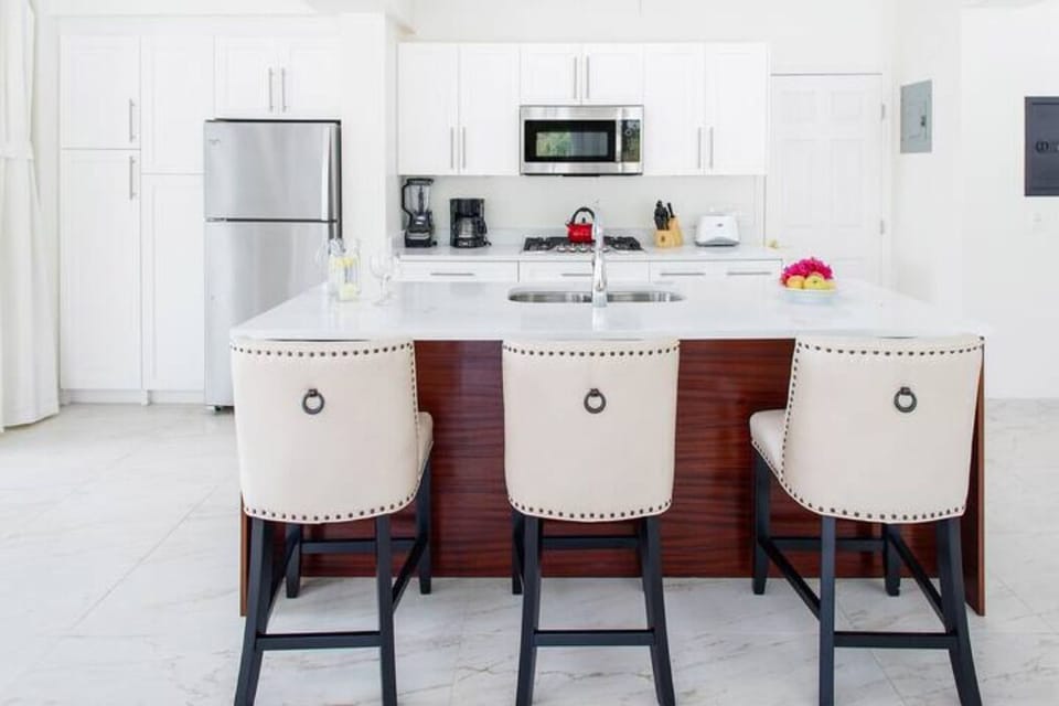 Discover a stylish and functional kitchen with a central island, providing ample space for meal preparation and cooking