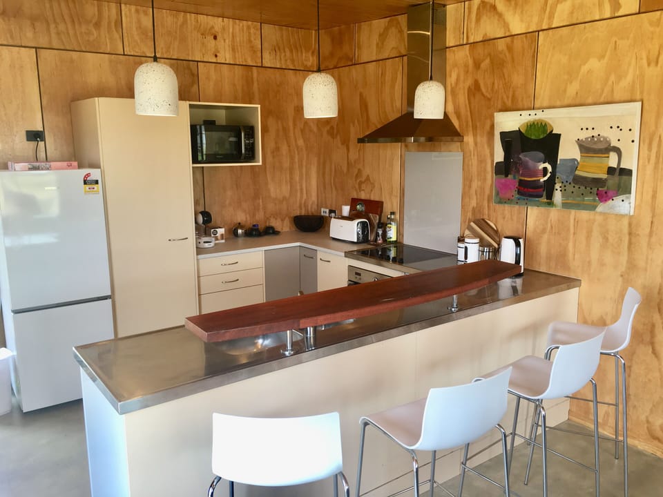 Fully equipped kitchen with indoor outdoor dining areas