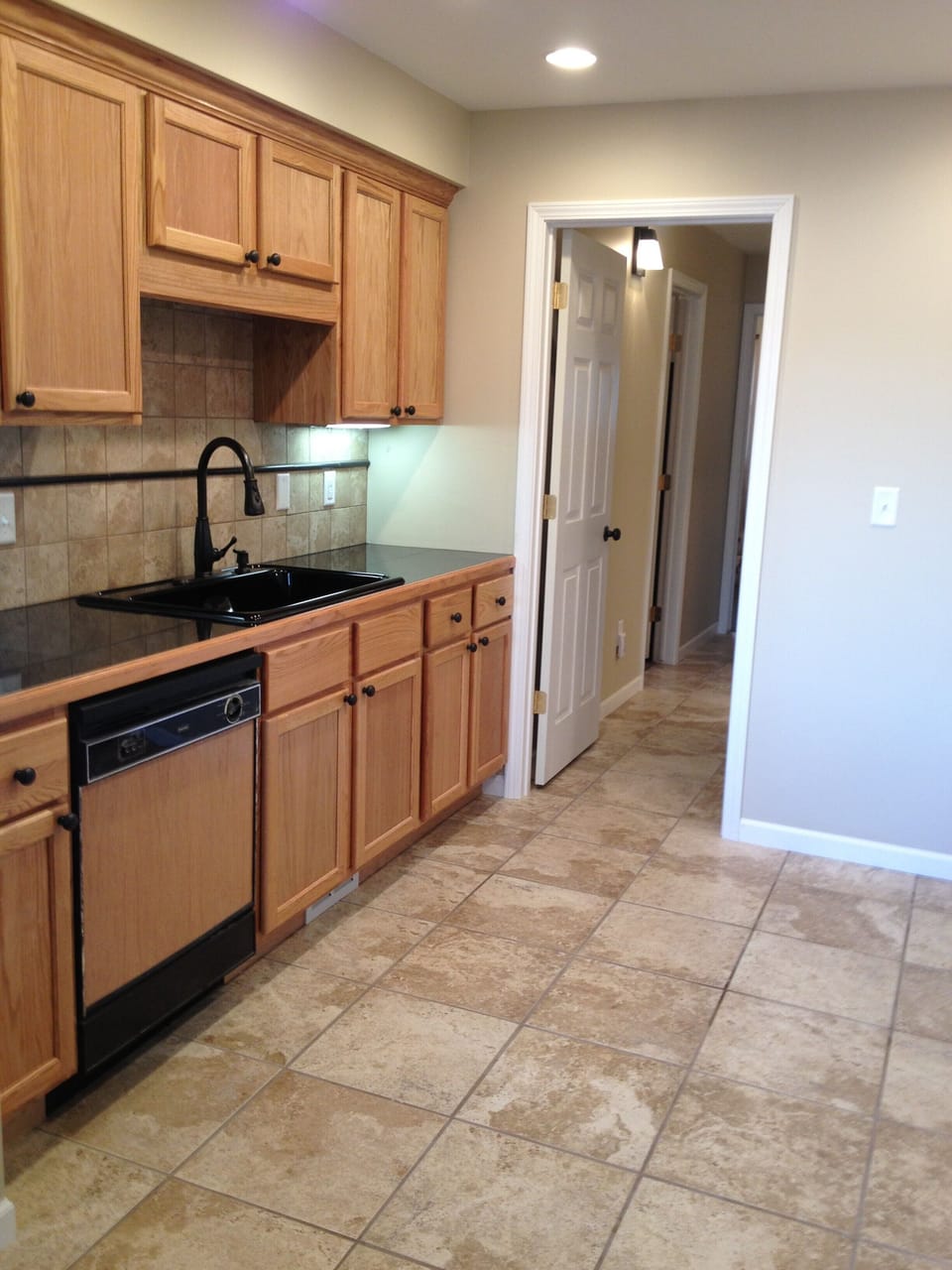 Kitchen-granite counters, stove, refrig. dishwasher. Hallway leads to bedrooms