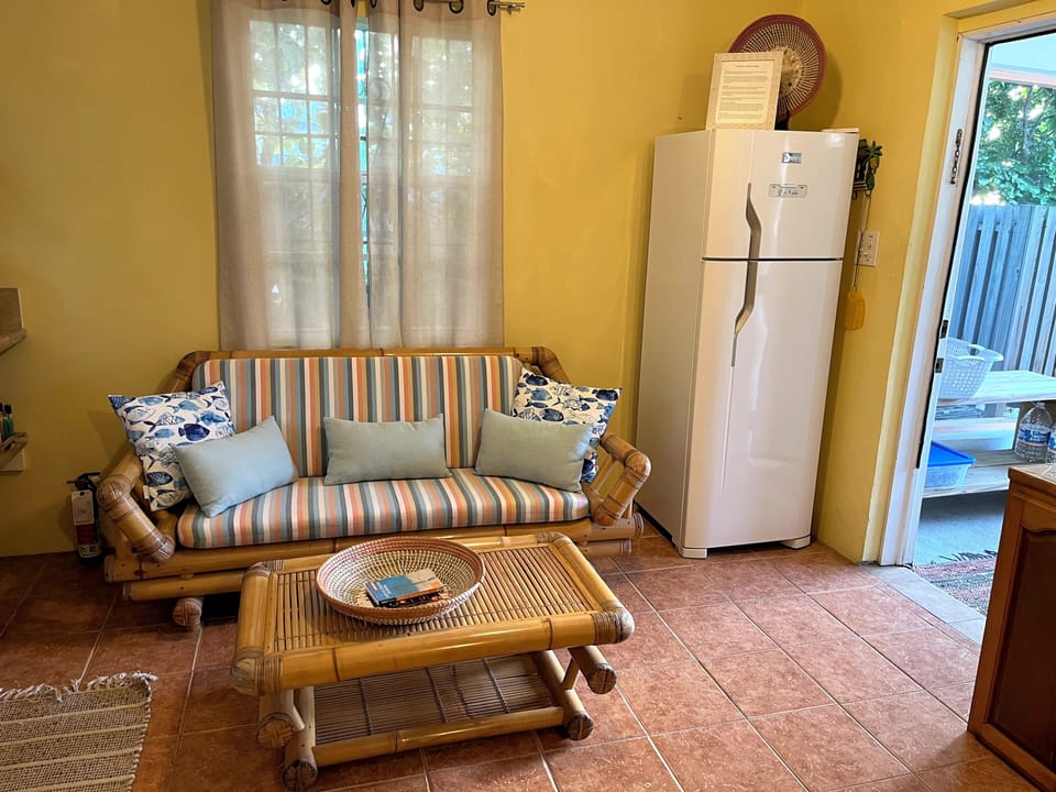 Sitting area inside with full size fridge.
