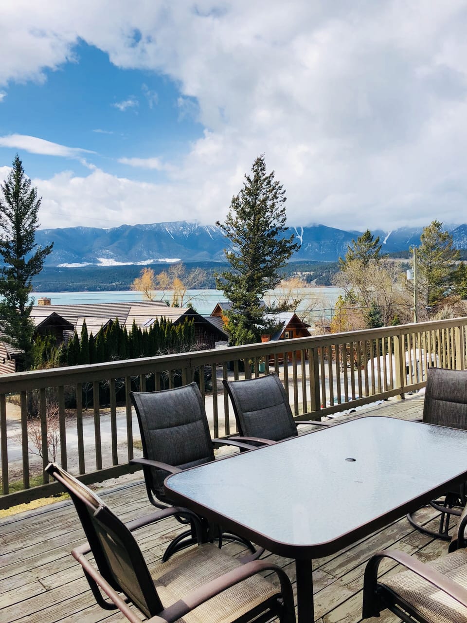 Large deck overlooking the mountains and lake with BBQ’s and large umbrella 