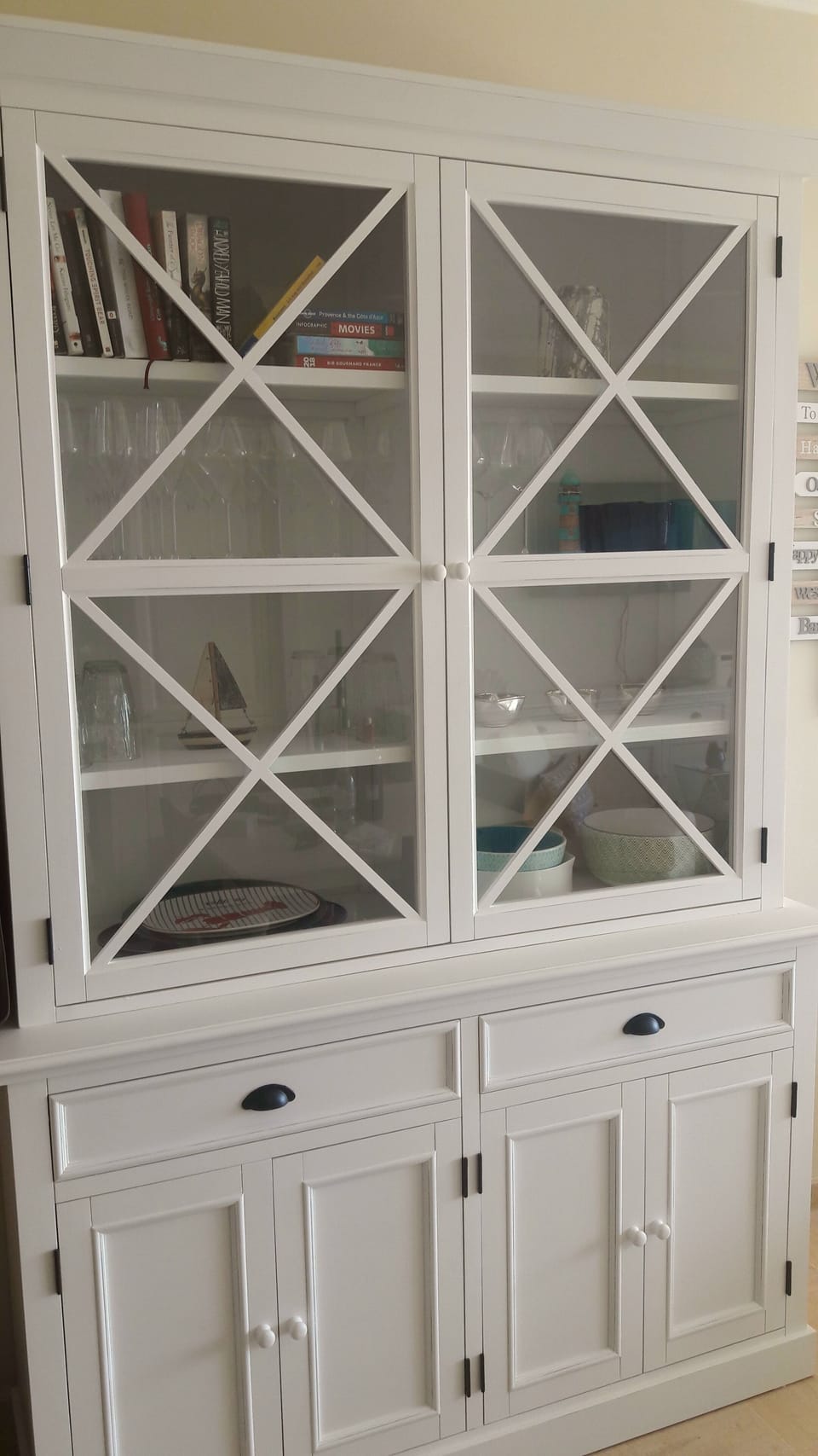 Dresser with books, games, extra kitchen gadgets and salad bowls etc